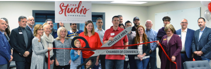 Former CSUS student Geoff Sakala is joined by friends and family at the opening of The Studio, his business in Roseville. 