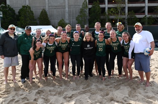 Lois Mattice, center, is surrounded by Sac State beach volleyball coaches and athletes.